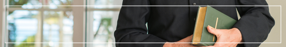 priest holding bible