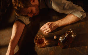 man struggling from alcohol addiction