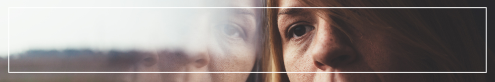 reflection of woman in window