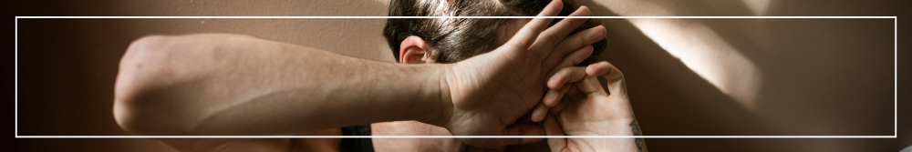 woman defending herself with hands