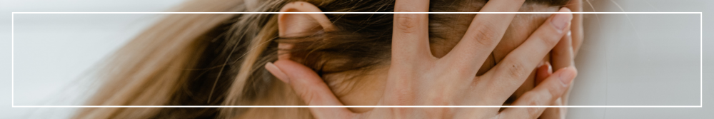 woman with head in her hands